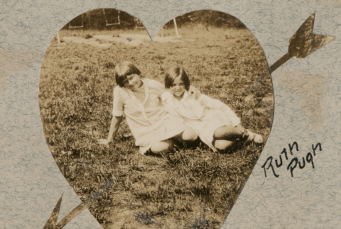 Two girls sitting in grass (ddr-densho-383-84)