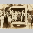 A person in an iron lung being transported by truck (ddr-njpa-1-1933)