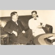 Hiroshi Saito and a man seated on a couch (ddr-njpa-4-2513)