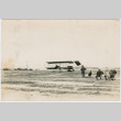 Photo of men watching flight of early bi-plane (ddr-densho-355-12)