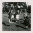 Children on swings at a park (ddr-densho-426-2465)