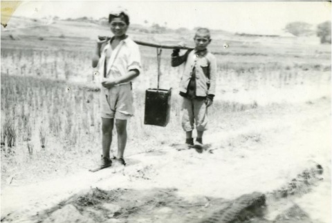 Okinawan boys carrying water (ddr-densho-179-142)