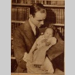 A man holding a baby (ddr-njpa-1-1665)