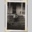 Man holding small boy sitting on steps (ddr-densho-466-881)