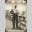 Man holding a toy (ddr-densho-542-124)