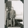 Two men standing outside camp building.  Joe Iwataki on right (ddr-ajah-2-549)