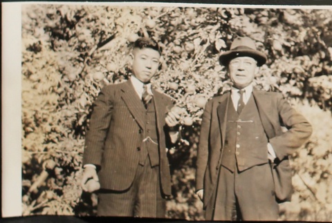Two men in an apple orchard (ddr-densho-259-260)