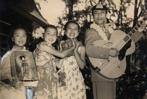 Hibari Misora posing with Haruhisa Kawada and two girls (ddr-njpa-4-963)