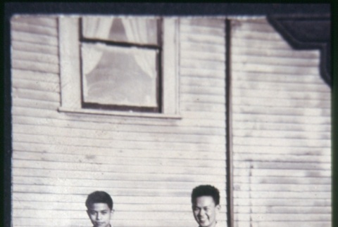 Two men stanidng outside building (ddr-densho-330-205)