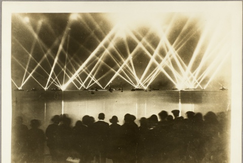 Crowd watching a searchlight demonstration by British navy ships (ddr-njpa-13-543)