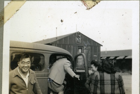 Friends getting into a car in camp (ddr-manz-4-158)