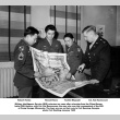 Four men looking at map (ddr-ajah-2-822)