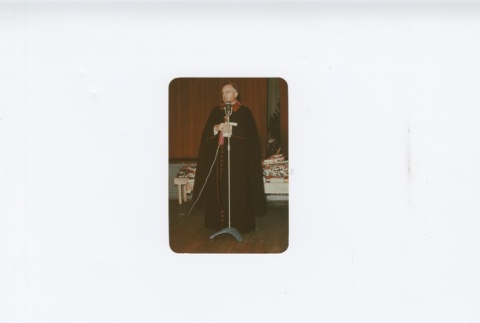 (Photograph) - Image of priest speaking at microphone (ddr-densho-330-285-master-3c0434072d)