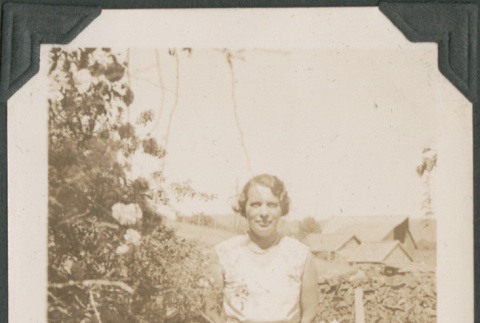 Woman by flowers (ddr-densho-316-244)