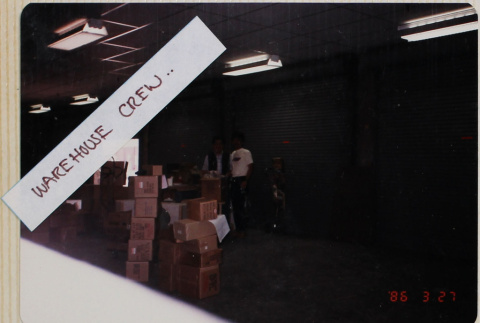 People standing by stacks of boxes (ddr-densho-426-1351)