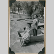 Women pose on a boat (ddr-densho-397-63)
