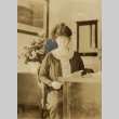 Woman seated at a desk (ddr-njpa-2-450)