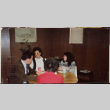 Four people at a table (ddr-densho-426-1289)