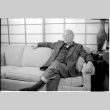 John Fujii on sofa (ddr-densho-1007-1175)