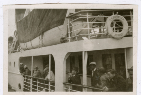 Men looking over railing of ship (ddr-densho-540-136)