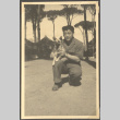 Man holding dog (ddr-densho-466-40)