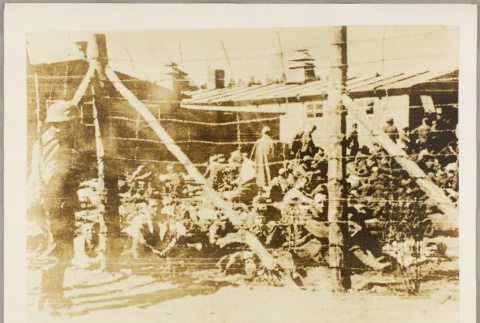 Prisoners behind a fence at a POW camp [?] (ddr-njpa-13-1086)