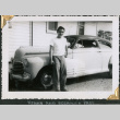 Man standing by car (ddr-densho-434-252)