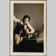 Tomoye (Nozawa) Takahashi posing with toy stuffed horse (ddr-densho-423-538)