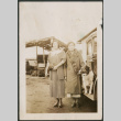 Two women and a dog by car (ddr-densho-316-197)