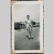 Young man in suit poses in street (ddr-densho-321-254)