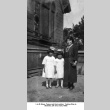 Woman and two girls outside church (ddr-ajah-6-918)