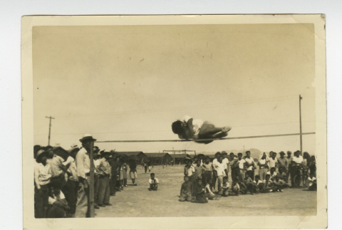 Mid-air jumping over raised horizontal bar (ddr-csujad-44-14)