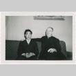 Priest and man sitting on couch (ddr-densho-330-289)