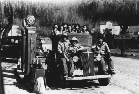 Japanese Americans riding on a truck (ddr-densho-34-31)
