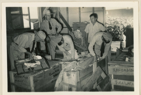 Baggage inspection for Tule Lake bound crates (ddr-densho-37-877)