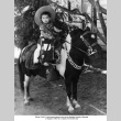 Young boy in cowboy costume riding pony (ddr-ajah-6-32)