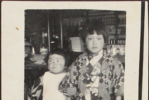 Two children in a store (ddr-densho-278-165)