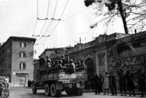 100th Infantry Battalion soldiers moving by truck (ddr-densho-114-3)