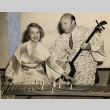 Lily Pons playing a koto and Andre Kostelanetz playing a shamisen (ddr-njpa-1-1341)