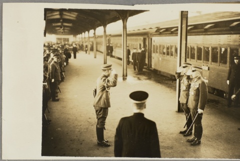 Soldiers saluting near a train (ddr-njpa-13-1538)