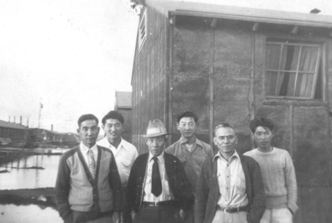 Japanese Americans in front of barrack (ddr-densho-106-8)