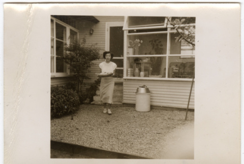 Woman carrying a platter (ddr-densho-433-1102)