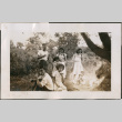 Group at picnic eating watermelon (ddr-densho-316-404)