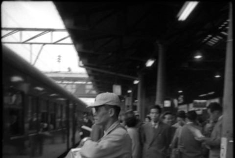 Street vendor on train platform (ddr-densho-426-2303)