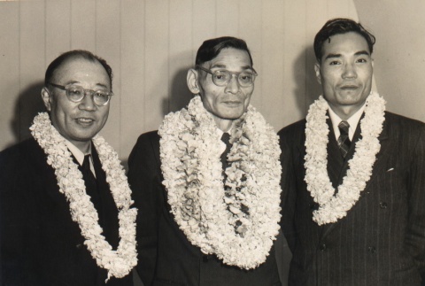 Hisato Ichimada, Gengo Suzuki and Ichimada's secretary posing with leis (ddr-njpa-4-116)