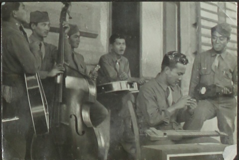 Japanese American soldiers playing in a band (ddr-densho-201-389)