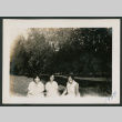 three women sitting on the ground (ddr-densho-378-621)