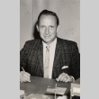 Man posing at his desk (ddr-njpa-2-965)