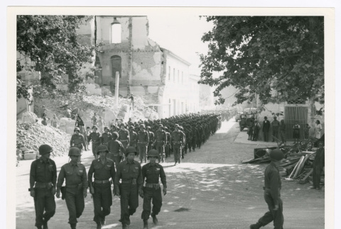 Members of the 100th Infantry Battalion marching in Vada, Italy (ddr-densho-1007-143)