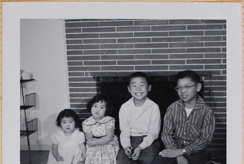 Leslie, Susan and William Shiomi with unidentified boy (ddr-densho-522-520)